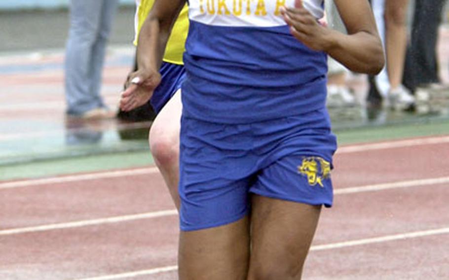 Yokota Panthers senior Lindaya Brown leads the charge down the stretch of the 100. Brown won in 13.21 seconds.