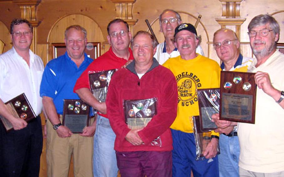Retiring DODDS-Europe high school coaches hold the plaques they received last month at Rheinblick Golf Course, near Wiesbaden, Germany.