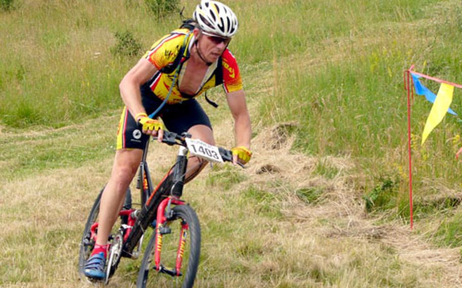 Overall champion James Sharp of Hanau races Saturday at Soldier’s Lake at Ansbach, Germany. Sharp, a 40-and-older master’s rider, won in 49 minutes, 8 seconds.