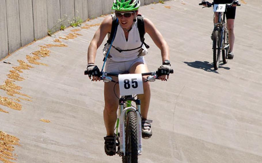 Jessica Tomazic of Schweinfurt takes a cool-down lap on the Sports Club Schopp velodrome after winning Sunday’s women’s 16-kilometer Ramstein Mountain Bike race in 1 hour, 2 minutes.