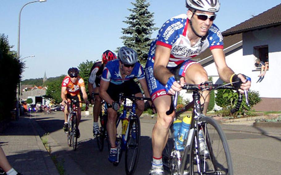Mike Gallagher of Fort Lewis, Wash., leads a group of riders through the final stages of Monday’s 72-kilometer Mackenbacher Evening Criterium in Mackenbach, Germany.