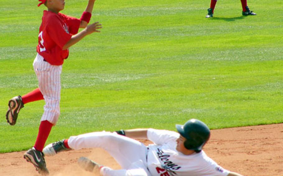 Sean Smith of Dubai steals second as the throw to shortstop Connor Oliver of Naples arrives too late. The play came during the UAE champions' five-run fifth Saturday at the Little League European Region's Transatlantic Regional tournament at Kutno, Poland. Naples rallied to win, 10-9.