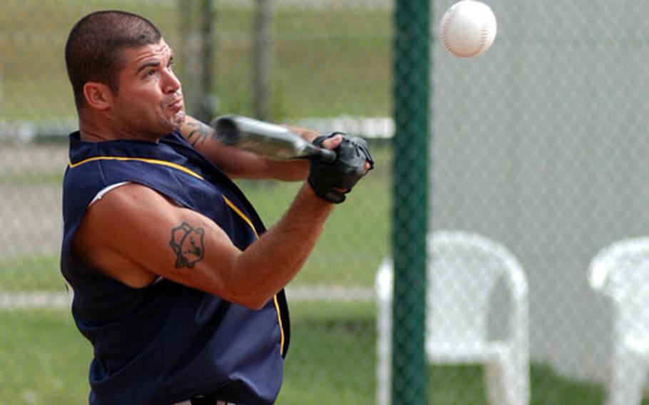Croughton batter Joe Elmore smacks a single to score a runner during the fourth inning of the USAFE Small Units Softball Tournament championship game Saturday.