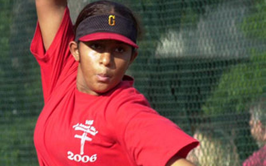 Bianca Lopez, a member of the Kaiserslautern, Germany, Little League fastpitch softball team, delivers during practice last week at Ramstein Air Base.