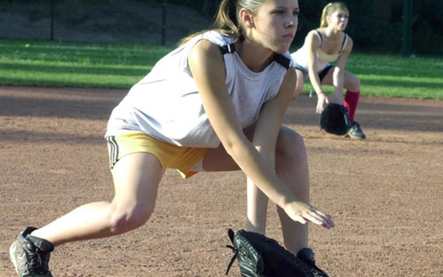 Mary Peterson, left, and Lindsey Jones get ready to field ground balls during a practice session for the Kaiserslautern, Germany, Junior fastpitch softball team at Ramstein Air Base last week. The team will be playing in the Junior World Series beginning Sunday in Kirkland, Wash.