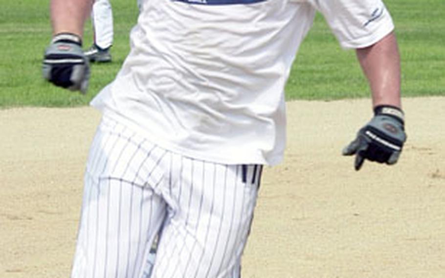 Ben Wilder of the Osan Mustangs races toward third base against Yongsan during Sunday’s Koreawide post-level softball tournament championship game.