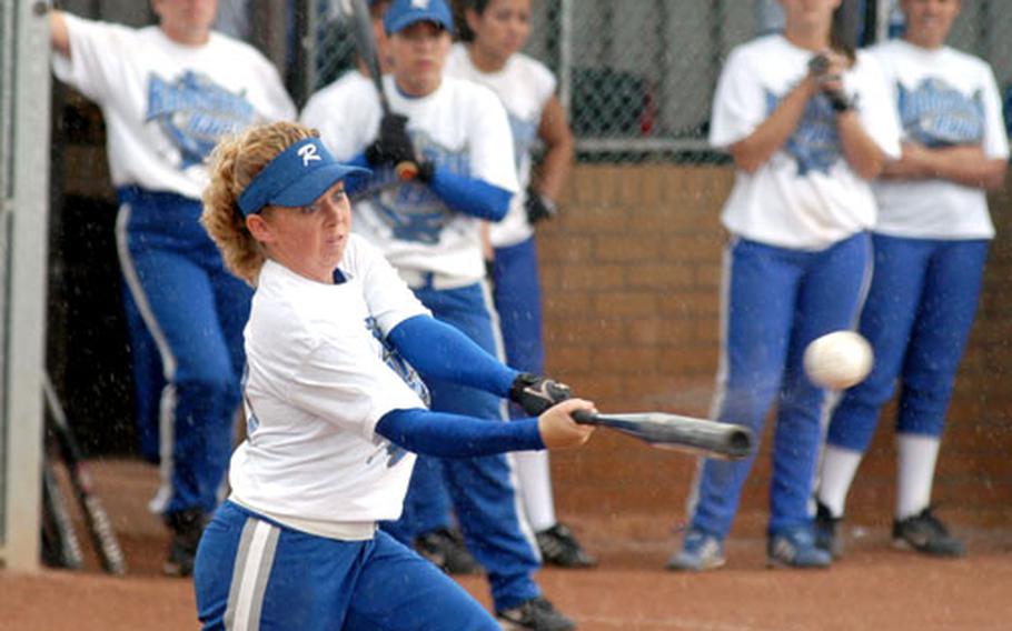 Ramstein Rames catcher Anna Rhoades lines a single during the championship game of the USAFE softball tournament against the Incirlik Nomads. Ramstein won 20-12.