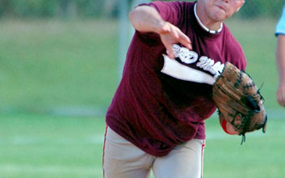 Shortstop Paul Yeater of 3rd Marine Logistics Group fires the ball to first base during an 11-9 victory over Marine Corps Base Camp Butler.