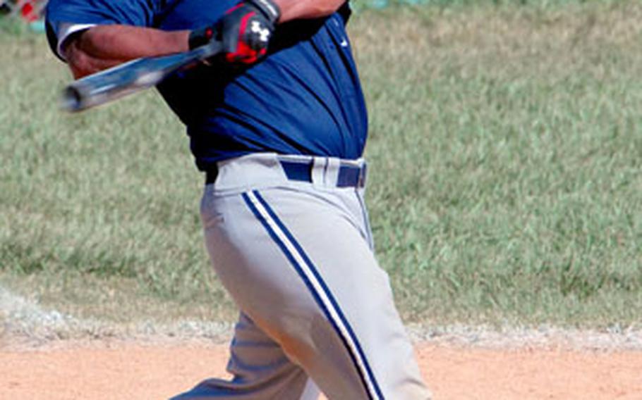 Andre Fung of Iwakuni Air Station swings against 3rd Marine Logistics Group in the 2006 Marine Forces Pacific Regional Softball Tournament at Camp Foster, Okinawa, on Friday.