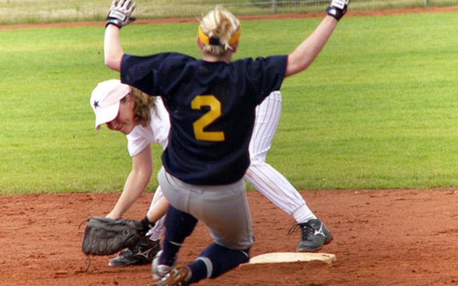 Heidelberg baserunner Leigh Anne Newcomer is forced out by SHAPE second baseman Kristy Brazell during Heidelberg’s 15-8 U.S. Forces Europe championship game victory Sunday in Grafenwoehr, Germany.