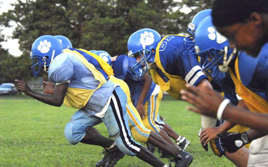 Yokota players run sprints during Tuesday’s practice at Yokota Air Base, Japan. The seven-time Japan Football League and Kanto Plain Association of Secondary Schools champs open the season Friday at Kinnick.