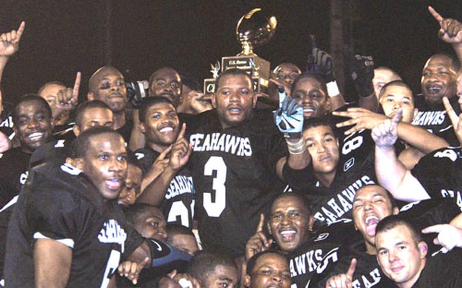 Yokosuka Seahawks players celebrate after shutting out the Misawa Marauders 12-0 in Friday’s U.S. Forces Japan-American Football League championship Torii Bowl at Berkey Field, Yokosuka Naval Base, Japan.