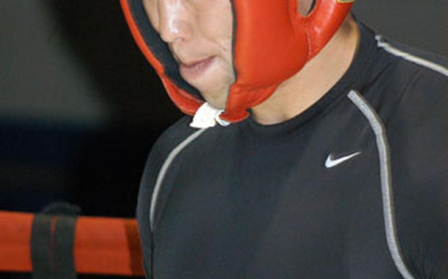 2nd Lt. John Rigsbee waits for his opponent to enter the ring during the Tough Soldier Boxing Invitational at Camp Carroll in South Korea last Saturday.