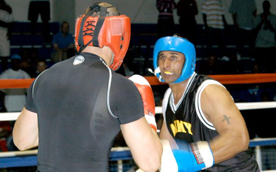 Staff Sgt. Geremy Ganaway, right, readies a punch at 2nd Lt. John Rigsbee during the Tough Soldier Boxing Invitational.