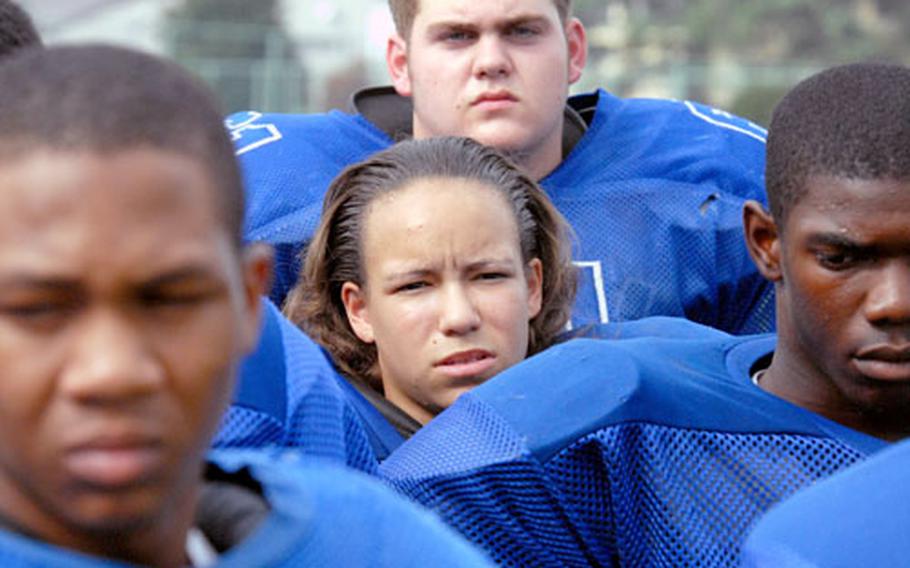 Just one of the guys: Yokota linemate Corey Reich says Samantha Little is a welcome addition to the Panthers football team. “She hits hard,” Reich says. “She gives it everything she’s got.”