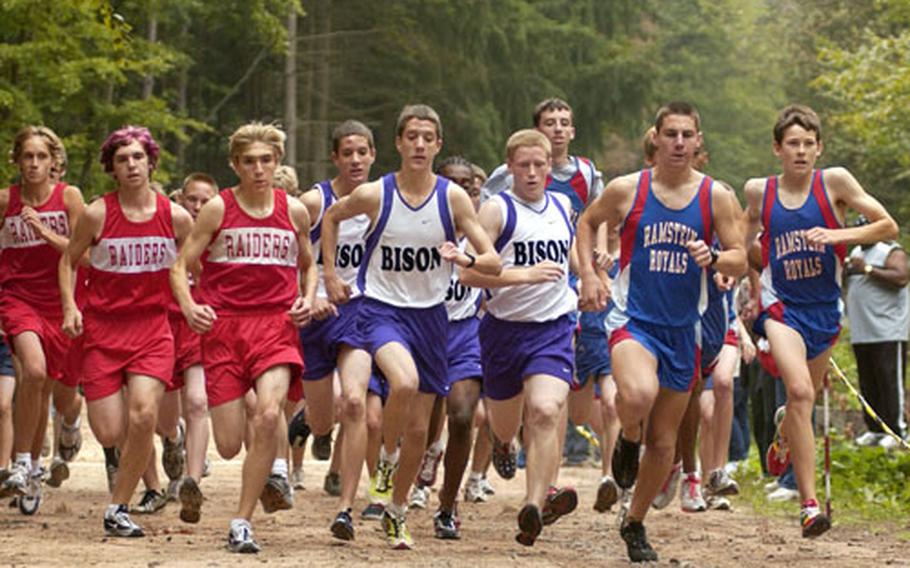 Ramstein runners Kyle Southard and Kevin Edwards, far right, lead the charge off the starting line during the first cross country race of the season held in Vogelweh, Germany, on Saturday.