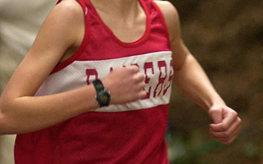 Colleen Smith makes her way to the finish line during the first cross country race of the season held in Vogelweh, Germany, Saturday. Smith finished first with a time of 20 minutes, 30 seconds.