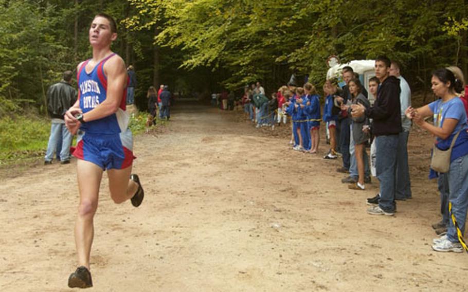 Ramstein senior Kyle Southard approaches finish line during a cross country race in Vogelweh, Germany, on Saturday. Southard finished first, covering 5 kilometers in 16 minutes, 43 seconds.