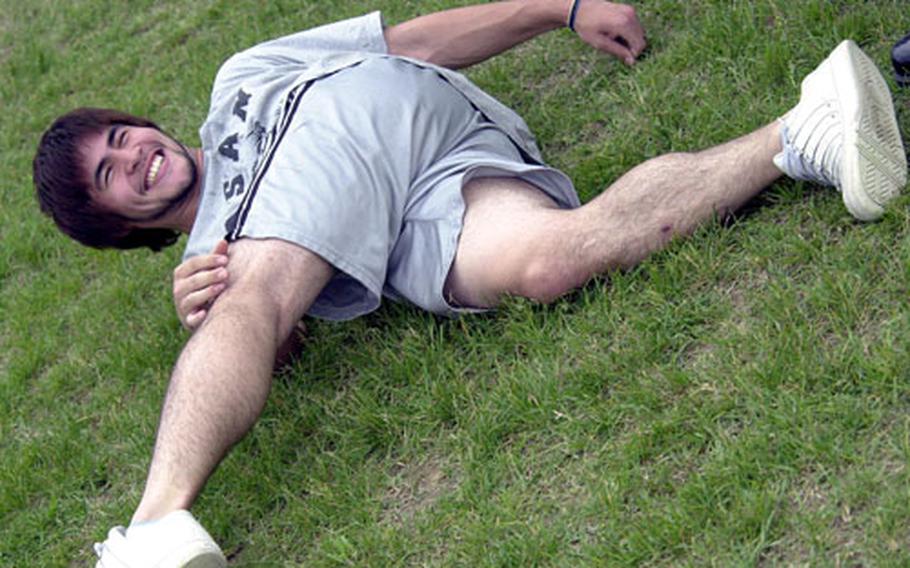 Osan American&#39;s Carlos Albaladejo limbers up during a workout in May at Osan Air Base, South Korea.