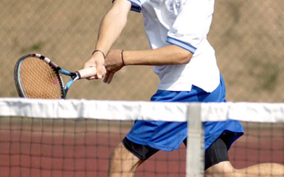 Matt Puchta of Ramstein High School sprints for a return during his doubles match against a SHAPE on Saturday. Puchta and teammate Shawn Kelley swept Jorge Rodriguez 6-0, 6-2, part of a 9-0 win for Ramstein.