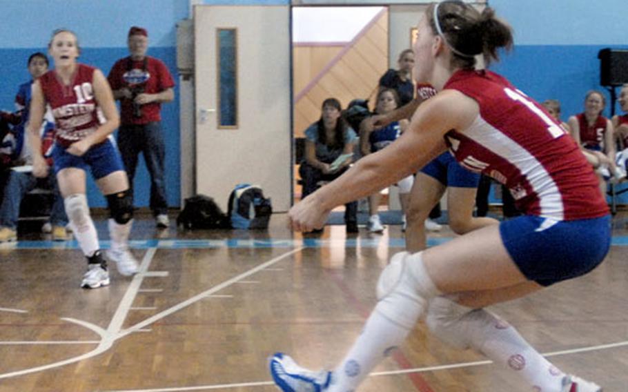 Tyler Fleenor from Ramstein bumps the ball during the opening season girls volleyball match at Ramstein on Saturday. Ramstein swept SHAPE 25-23, 25-20, 25-13.