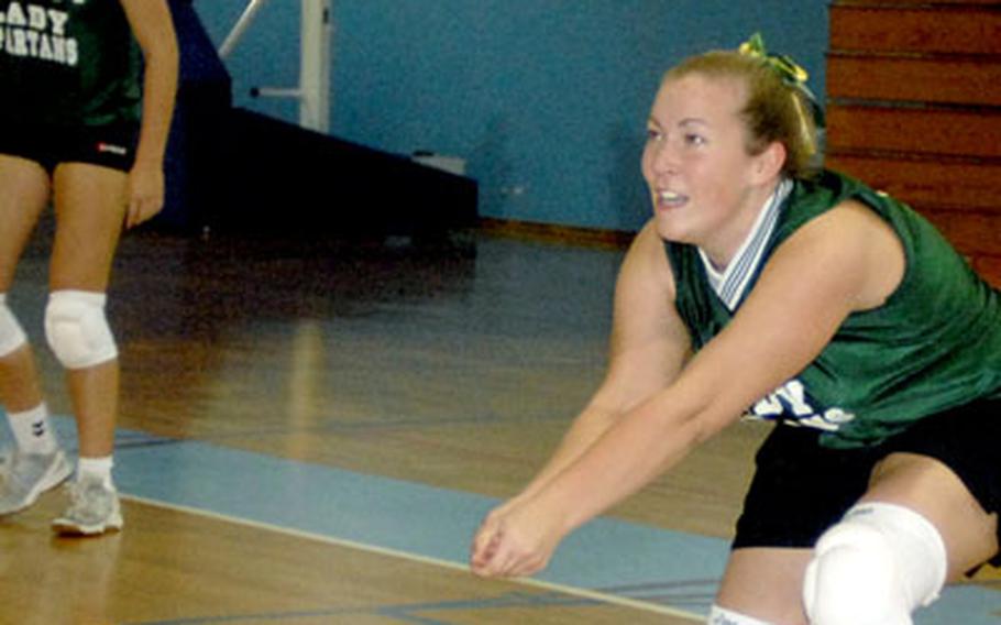 Kristen Whitney from SHAPE bumps the ball during a match against Ramstein.