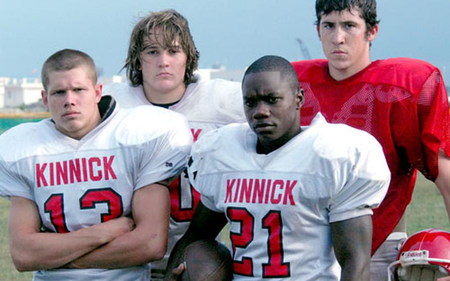 Chad Atchley, second from left, and senior Clay Atchley, right, transfers from James Bowie High in Texarkana, Texas, have added a new dimension to a Nile C. Kinnick team formerly dependent on its running game.