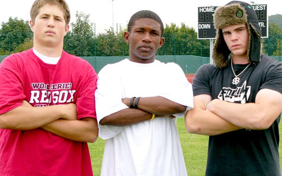 Würzburg High School tailback D.B. Bryant is flanked by guards Dan Riley, left, and Sean Hipe, who helped spring him for 437 rushing yards on 32 carries Saturday in an 80-48 victory over Vicenza.