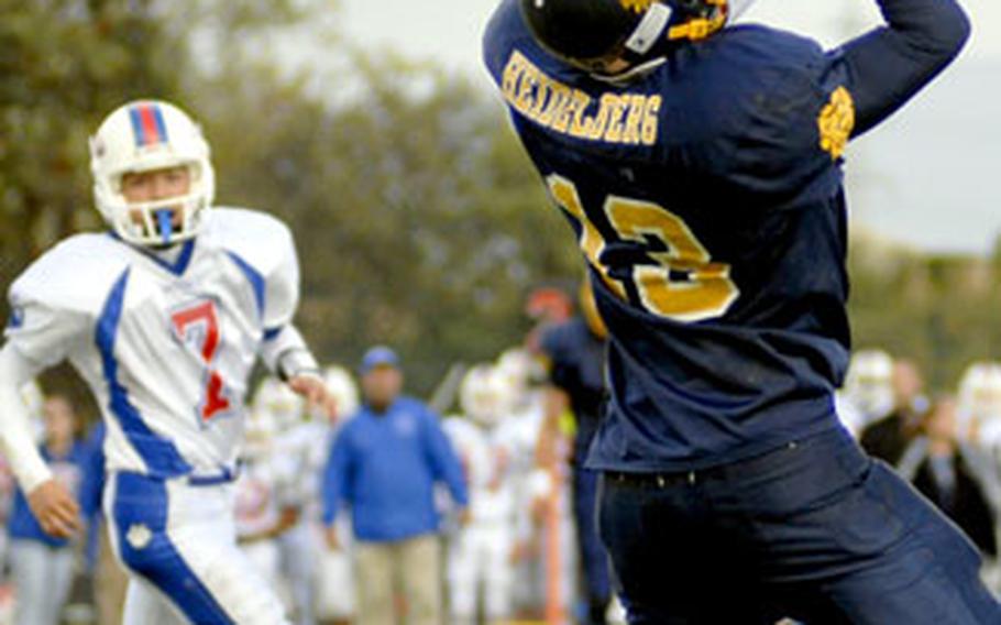 Heidelberg’s Zach Tapp-Wilson intercepts a pass from Ramstein quarterback Aaron Jones at the end of the first quarter Saturday.