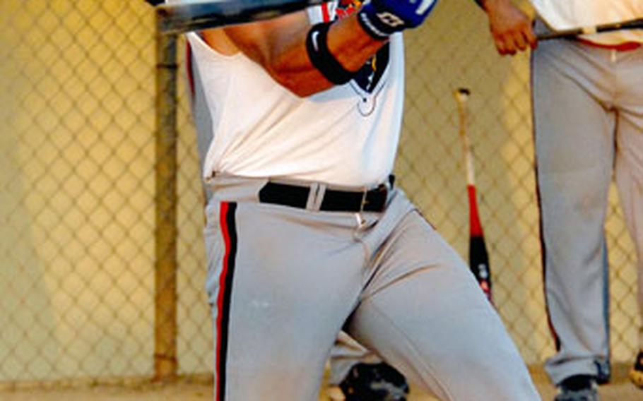 Jim Flagg of Okinawa’s American Legion rips a first-inning home run against the Okinawa Shogun during softball action Sunday in the Kadena Klassic at Kadena Air Base, Okinawa. Legion was the tournament champion.