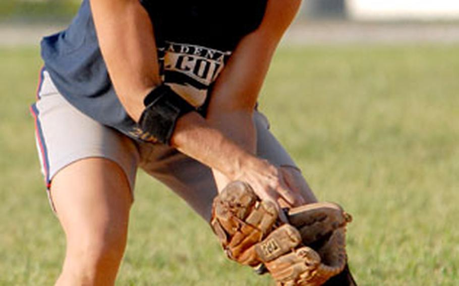 Shortstop Marcy Erickson of the host Kadena Falcons can’t get the handle on a ground ball during Sunday’s Kadena Klassic women’s championship game.