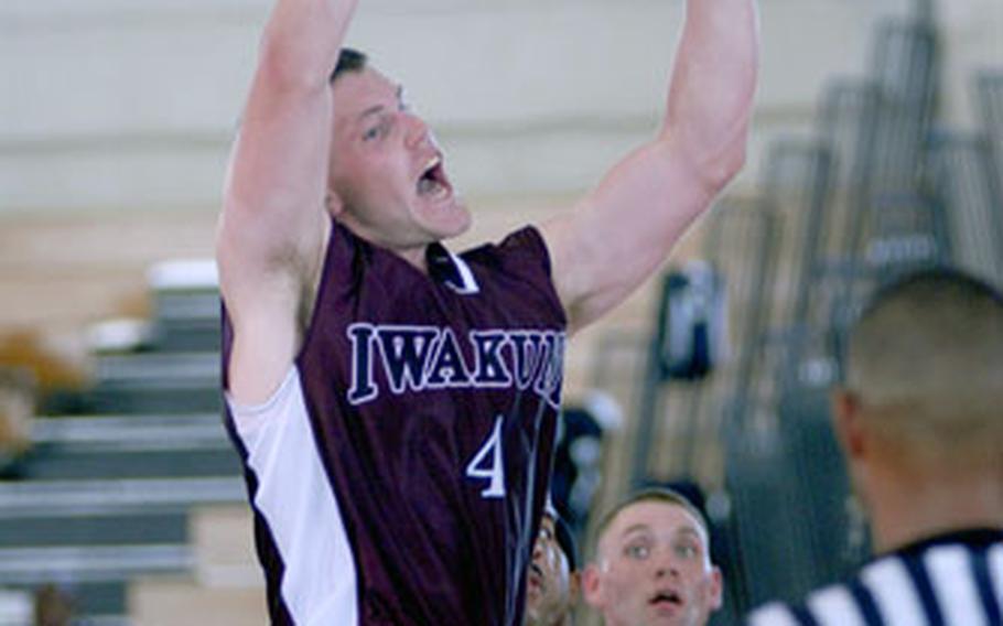 Forward David Turkington of Iwakuni Air Station loses the handle on the basketball against 1st Marine Aircraft Wing during Friday’s quarterfinal game at Camp Foster, Okinawa.