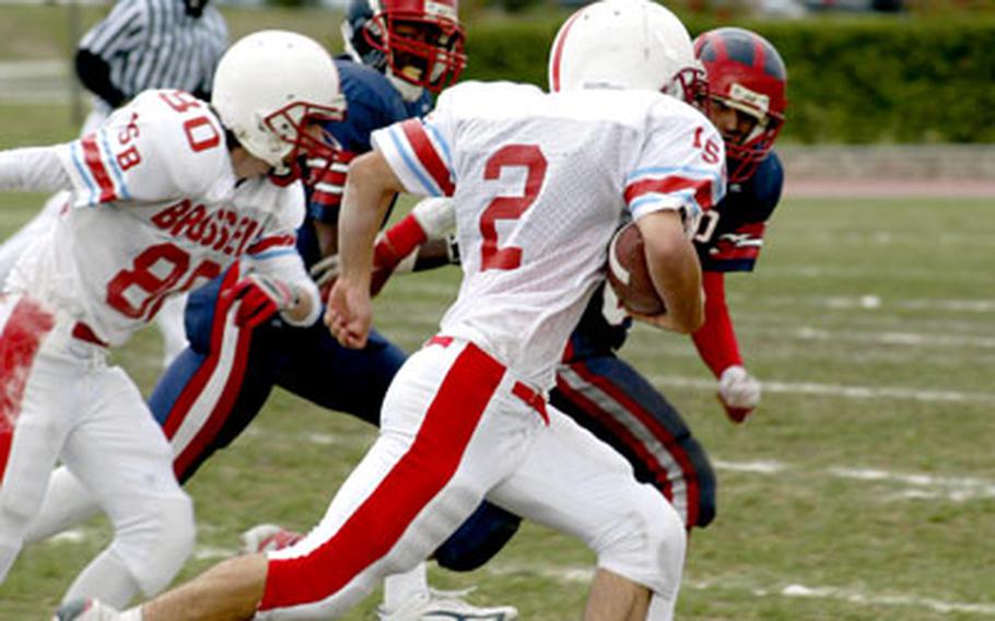 ISB junior running back Philip Feldman heads toward the right sideline Saturday during the Raiders’ 20-6 victory over Aviano in Italy. Feldman rushed 11 times for 64 yards in the first half as his team built a 20-0 advantage.