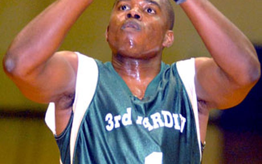 Trevor Highsmith of 3rd Marine Division/Expeditionary Force focuses in on a foul shot against Marine Corps Base Camp S.D. Butler during Saturday’s championship game in the 2006 Marine Forces Pacific Regional Basketball Tournament at Camp Foster, Okinawa. Highsmith scored 35 points as Division dethroned two-time defending champion Base 91-73.