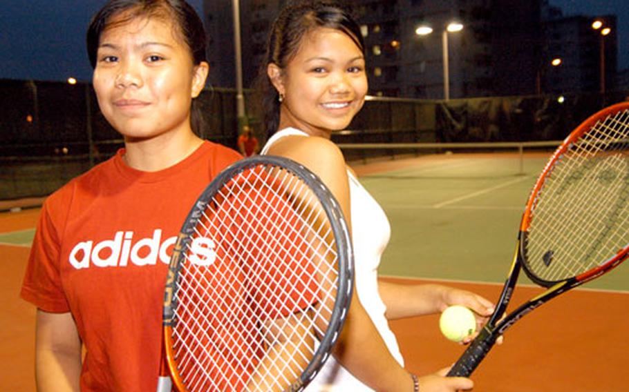 E.J. King junior and Far East tennis singles and doubles champion Kristia Suriben, left, and her freshman sister Rizalina are considered favorites to battle for the Far East singles and team titles next month.