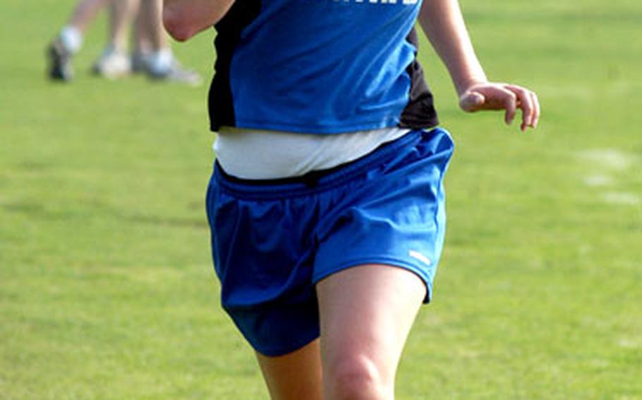 London Central’s Samantha Beatty sprints to the finish line during a cross country race at Hinchingbrooke Park in Huntingdon, England, near RAF Lakenheath. Beatty isn’t the top runner but is the team leader.