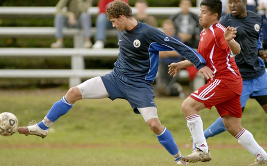 Bryan Liston from Lakenheath finesses the ball around Juan Martinez of Spangdahlem during the first half of the USAFE Men’s Championship soccer tournament held Friday at Sembach, Germany. Lakenheath shut out Spangdahlem 1-0 in the final.