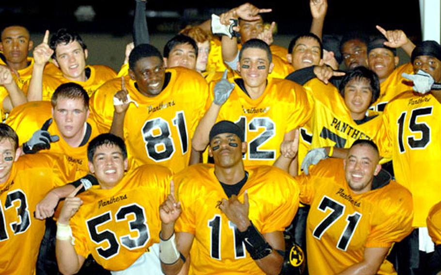 Kadena Panthers players pose after beating the Kubasaki Dragons 14-8 on Oct. 20 at Mike Petty Stadium, Kubasaki High School, Camp Foster, Okinawa. Kadena will face Japan Football League champion Yokota in the Far East Class AA semifinal on Nov. 4.