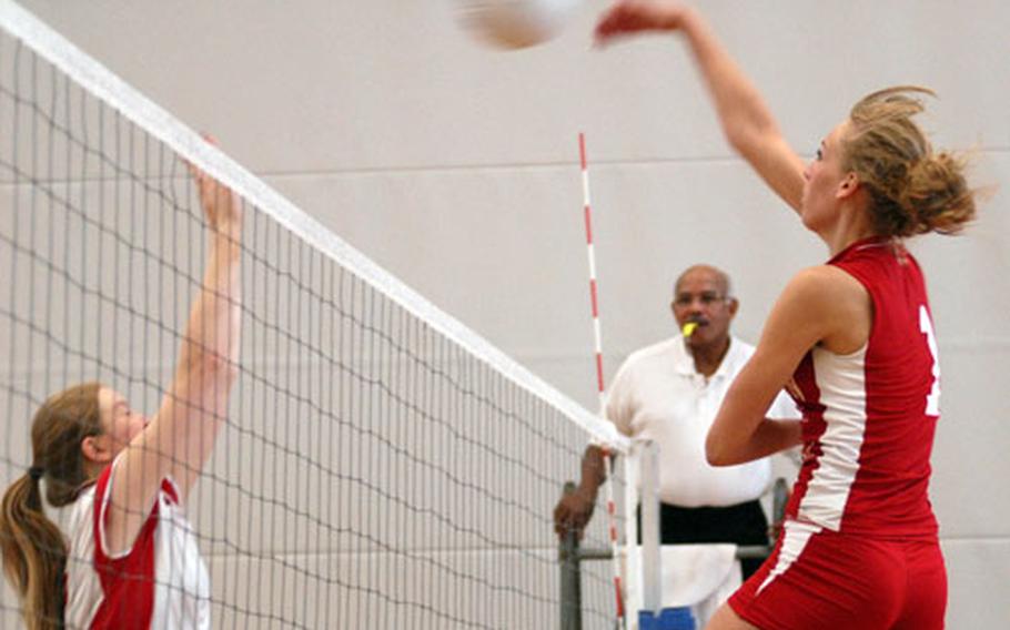 Kaylen Bannister from Ramstein spikes over Lakenheath at Vogelweh on Friday. Ramstein beat Lakenheath 25-22 and 25-20.