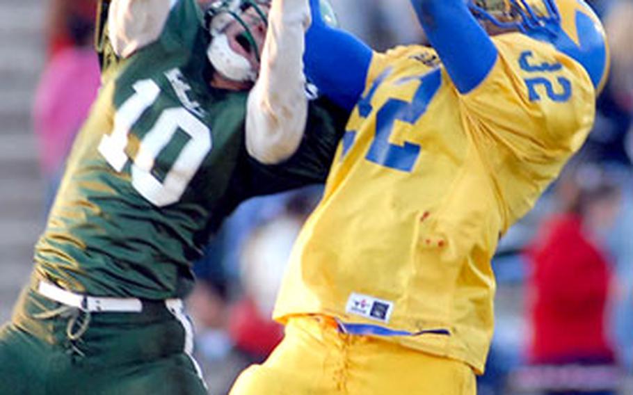 Ansbach’s Xavier Sheppard pulls down a pass as AFNORTH’s Chris Eden tries to defend.