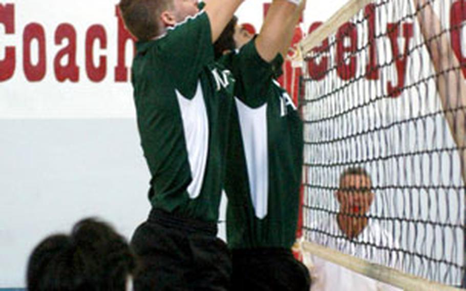 Naples’ Mark Ryan, left, and Brian Baldwin form a wall in an attempt to block a shot by Black Forest Academy during Saturday’s championship match in DODDS’ Mediterranean Region boys tournament on Saturday.