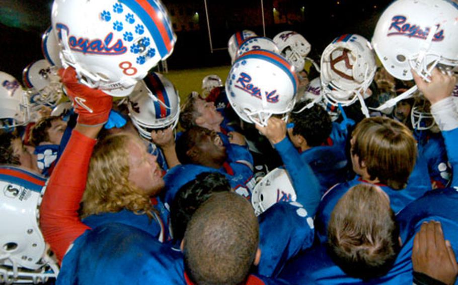 The Ramstein Royals celebrate their Division I DOODS-Europe football title after defeating the Heidelberg Lions 26-7 in Baumholder, Germany, Saturday night.