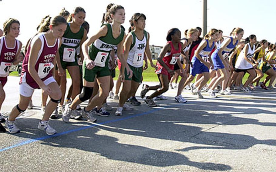 Runners take off across the start line of the girls 3.1 mile indiviual race at the 2006 Far East Cross Country Championship Meet at Camp Hansen on Monday.