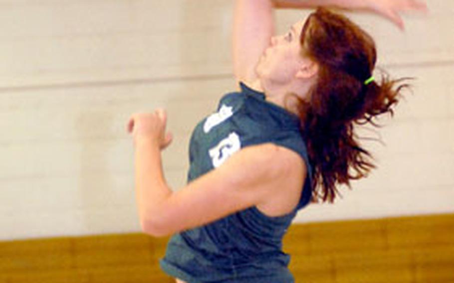 Kubasaki senior Chloe Freeman leaps to spike the match-clinching kill against the Zama American Trojans of Japan during Tuesday’s divisional play in the 2006 Far East High School Girls Class AA Volleyball Tournament at Collier Field House, South Post, Yongsan Garrison, South Korea. Kubasaki of Okinawa swept Zama 25-15, 25-13.