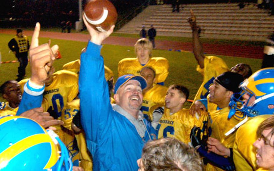 Head coach Marcus George and his Ansbach Cougars celebrate their Division III football title after beating AFNORTH, 34-6, on Nov. 4. Geroge was named the DODDS-Europe football coach of the year.