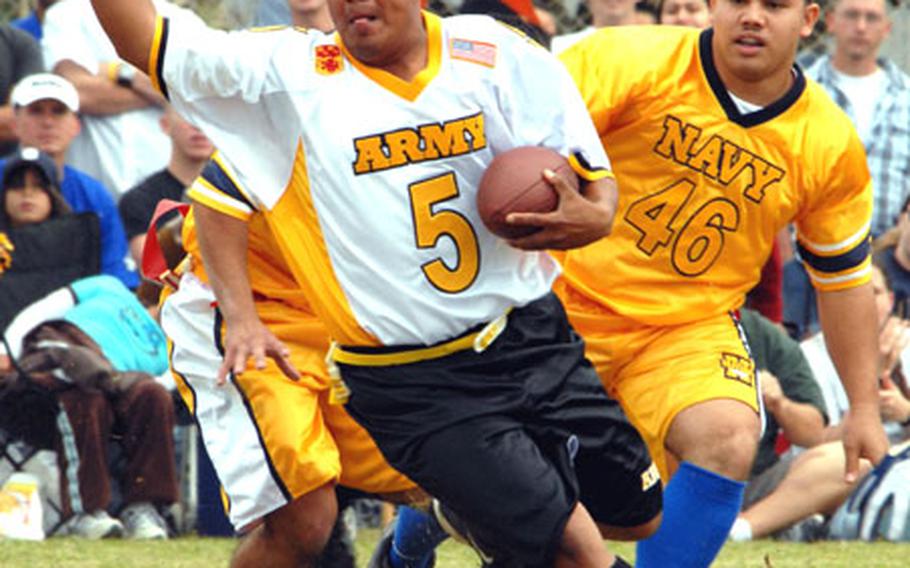 Army running back Brandon Thorne (5) tries to evade Navy defender Rodrigo Carino (46) during Saturday&#39;s Army-Navy flag football game at Torii Station, Okinawa. Army won the second-highest scoring game in the 17 years of the rivalry, 49-28.