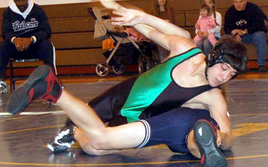 Torian Whetstone of Taegu American pins Ryan Bailey of E.J. King during Saturday&#39;s quadrangular wrestling meet at Taegu American School.