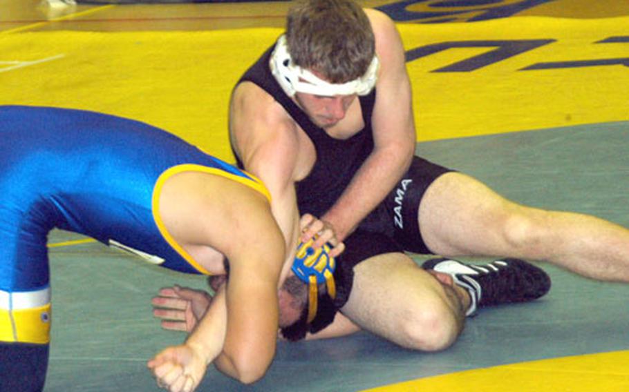 Yokota&#39;s Kyle Shimabukuro, left, tangles with Tim Campbell of Zama in the semifinals of the 180-pound division during Saturday&#39;s Kanto Plain Invitational. Shimabukuro emerged with the win on points.