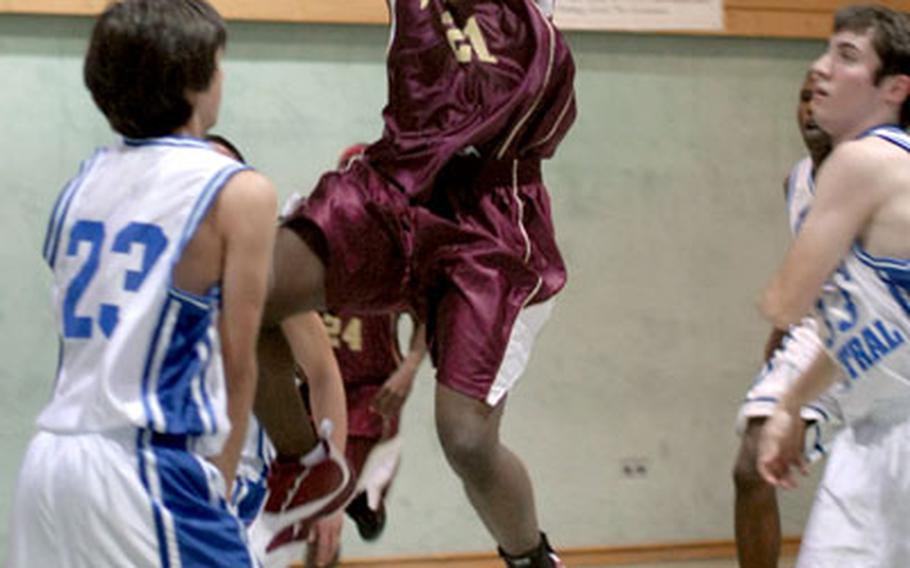 Baumholder&#39;s Sonny Clark from Baumholder drives down the middle during Saturday&#39;s game against London Central. Clark led the Buccaneers with 21 points in a 51-29 victory.