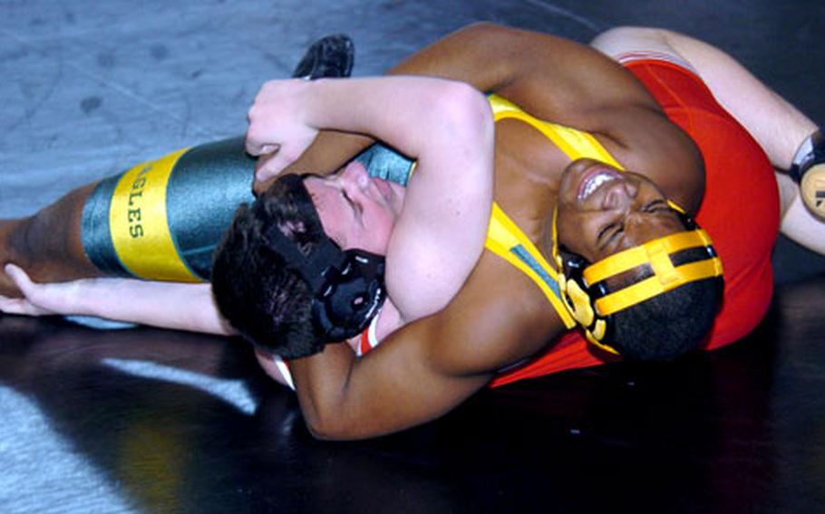 Keith Delaine of Robert D. Edgren gets the upper hand on Thomas Rodgers of Nile C. Kinnick in a 148-pound bout during Saturday&#39;s Kanto Plain Association of Secondary Schools dual-meet tournament at Zama American High School, Camp Zama, Japan. Delaine won by pin.